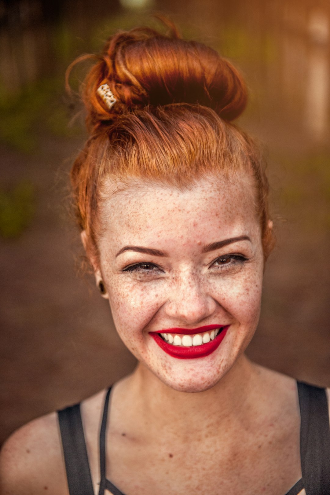 woman taking photo while showing smile